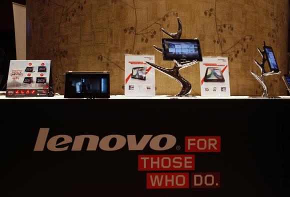 Lenovo tablets and mobile phones are displayed during a news conference on the company's annual results in Hong Kong