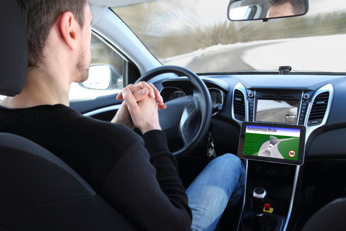 36488489 - a man in a autonomous driving  test vehicle