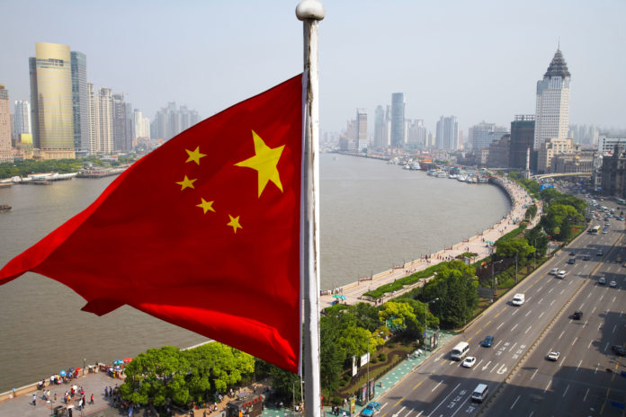 Chinese flag overlooking cityscape, Shanghai, China CCTV pintar