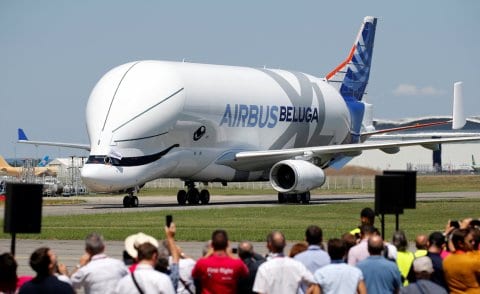 People take pictures as an Airbus Beluga XL transport plane lands during its first flight event in Colomiers near Toulouse