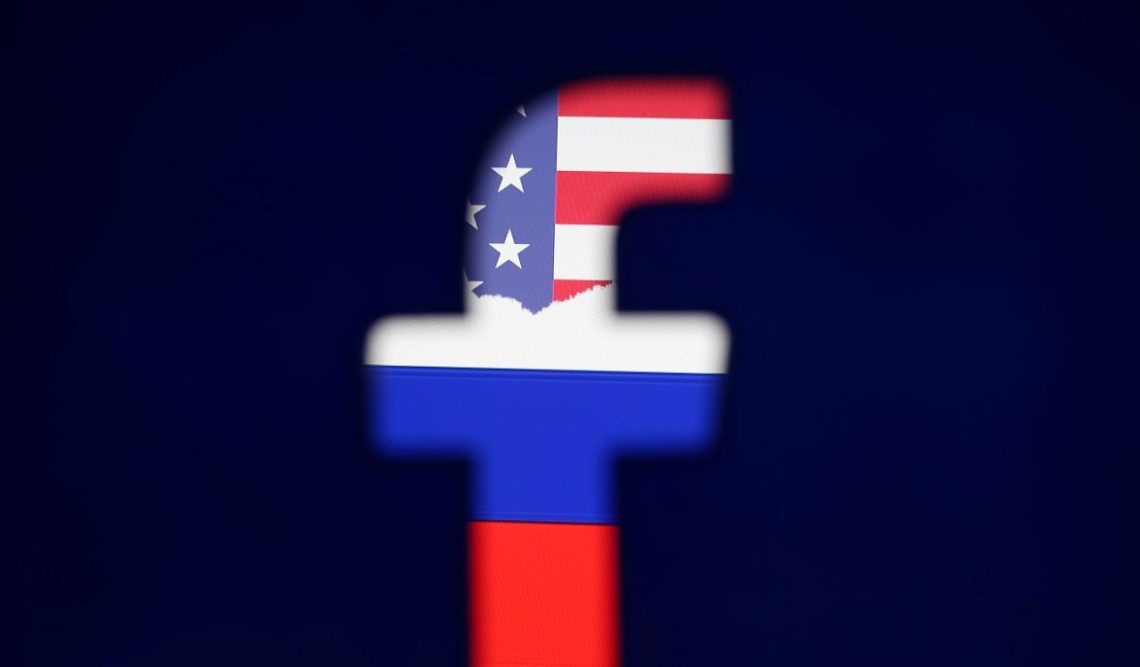 FILE PHOTO: Photo illustration of a 3D printed Facebook logo in front of a displayed Russian flag Bisnis UMKM