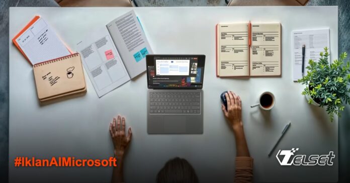 Microsoft Gunakan AI untuk Iklan Surface, Tak Ada yang Sadar! Seseorang bekerja di meja rapi dengan laptop Surface dan perlengkapan kantor lainnya