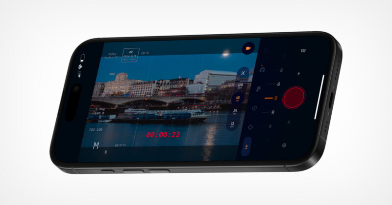 A smartphone displaying a camera app interface, showing a video recording of a cityscape with buildings, a river, and boats, along with camera controls and a recording timer on screen.