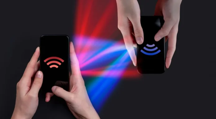 image-1748176465776-7275.webp Proses transfer data nirkabel antara smartphone Android dan iPhone