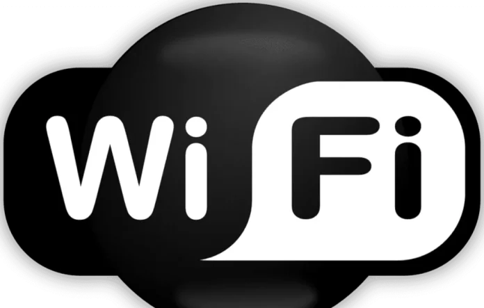 image-1758978647263-8339.webp Ilustrasi laptop dan smartphone terkoneksi WiFi dengan logo Bnetfit di latar belakang, menandakan paket internet untuk rumah dan kantor.