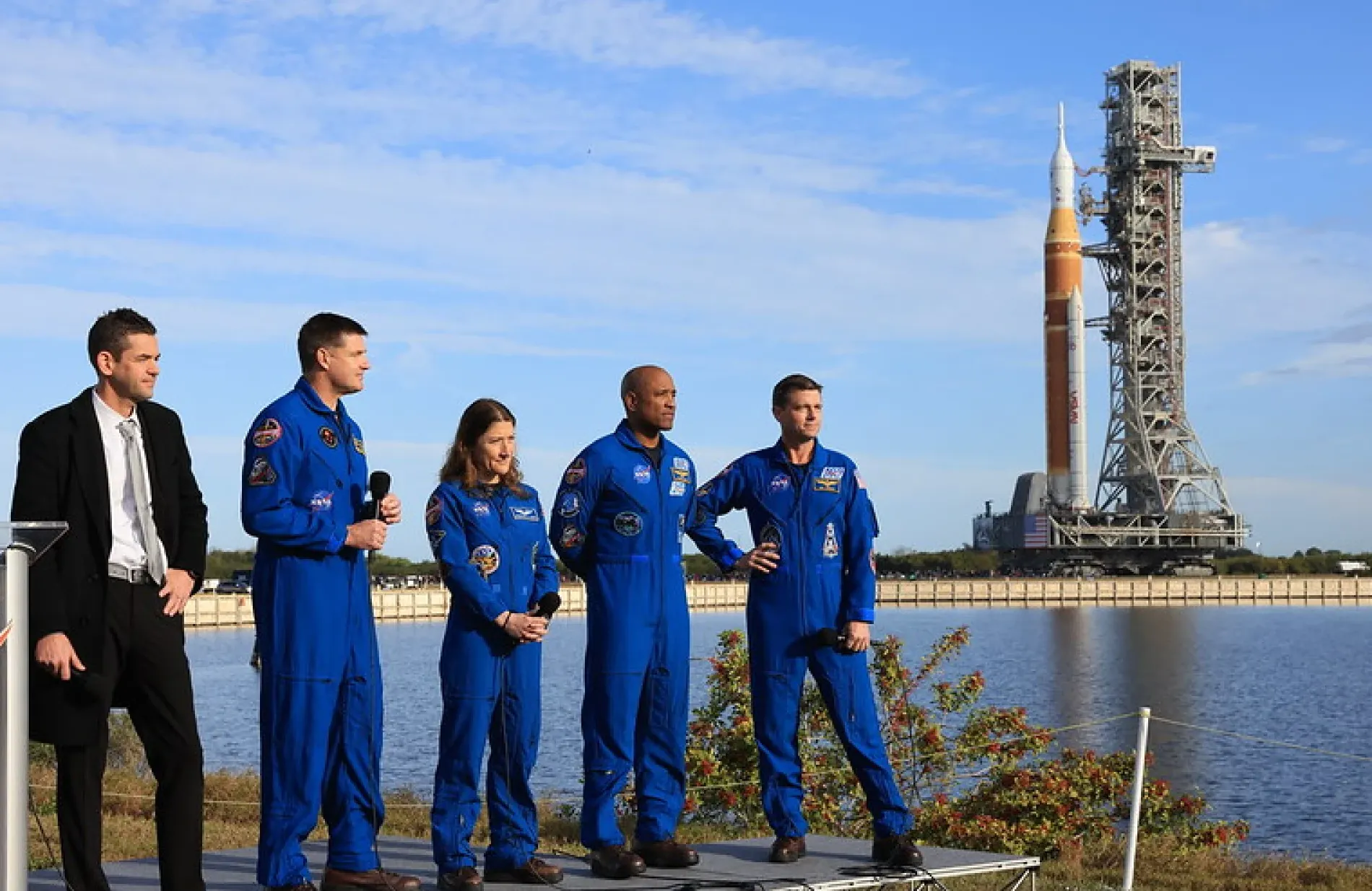 NASA administrator and Artemis 2 crew talking to reporters as SLS rocket rolls behind them on Jan. 17, 2026